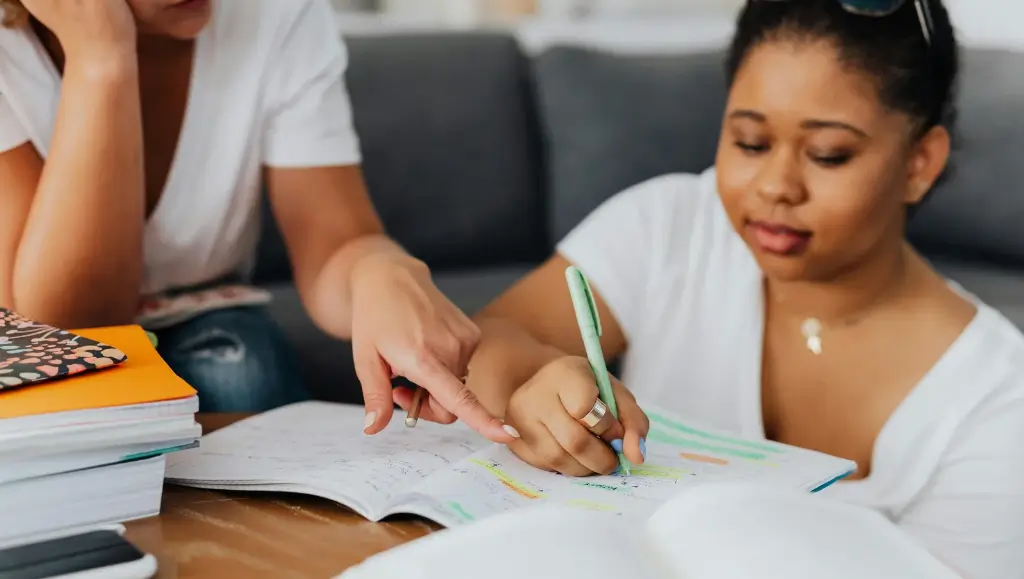 An image of a female teacher and a female student 