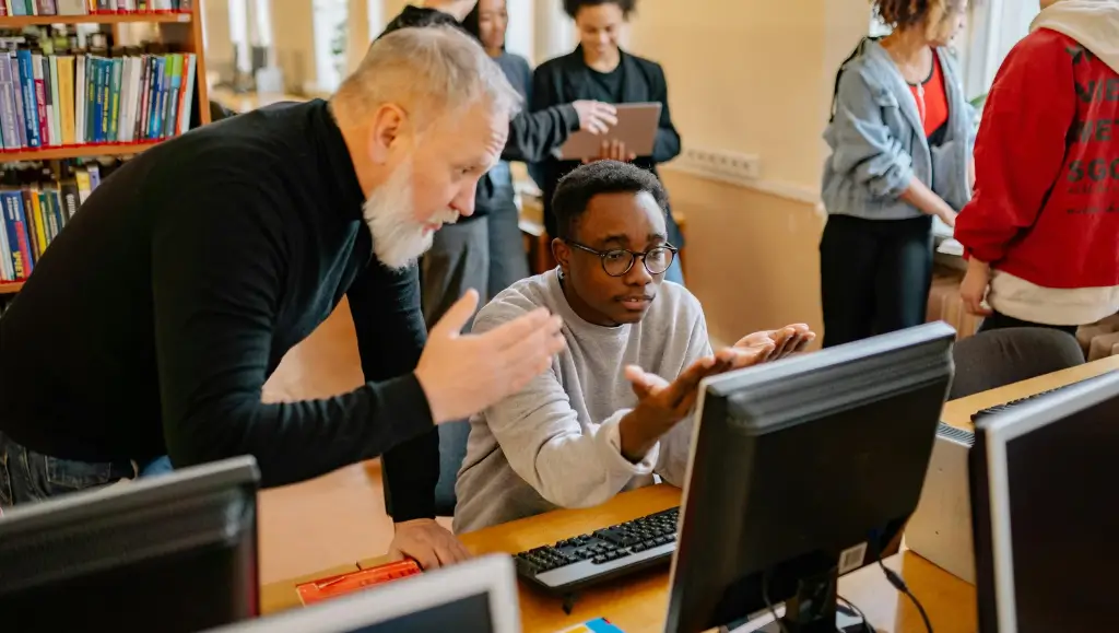 An image of a teacher putting a student through in an online class activity 
